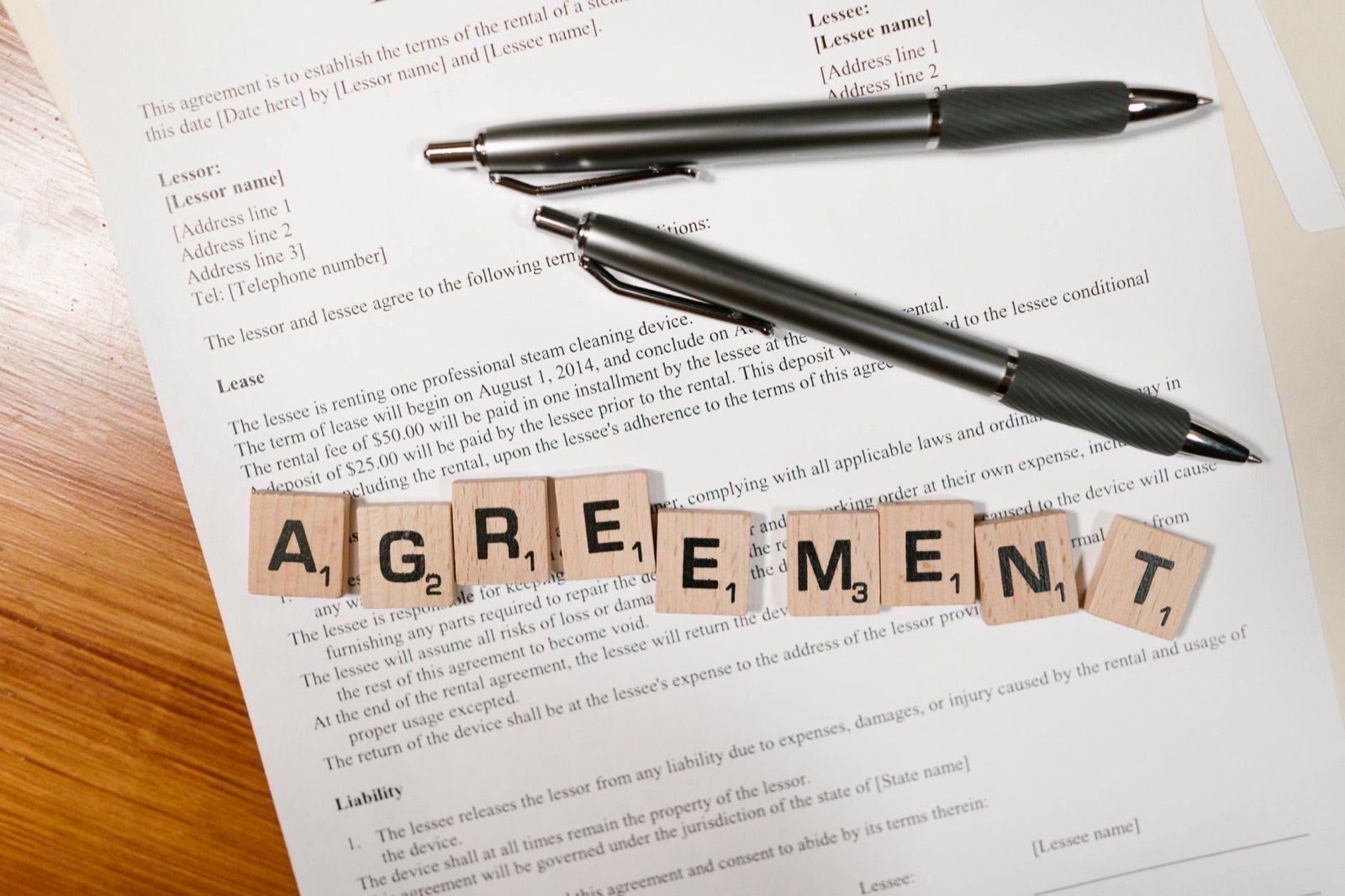 A bound deed and a certified translation set out before a notarial appointment.