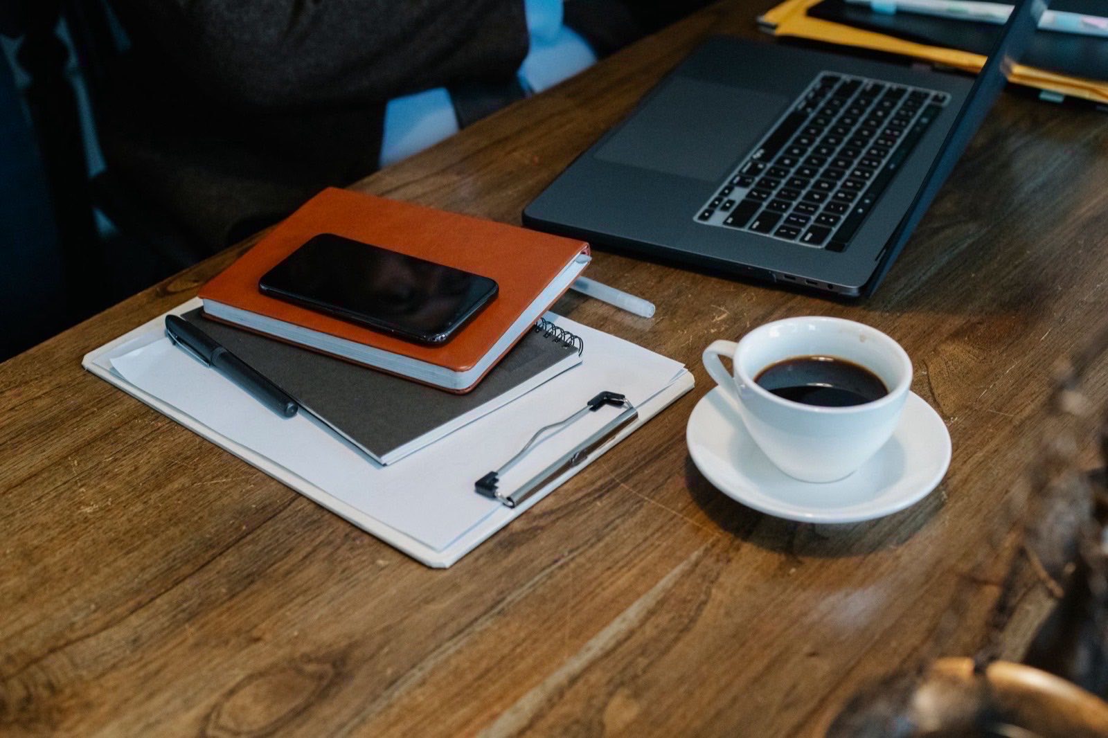 A desk with company paperwork and a laptop during an Austrian filing period.