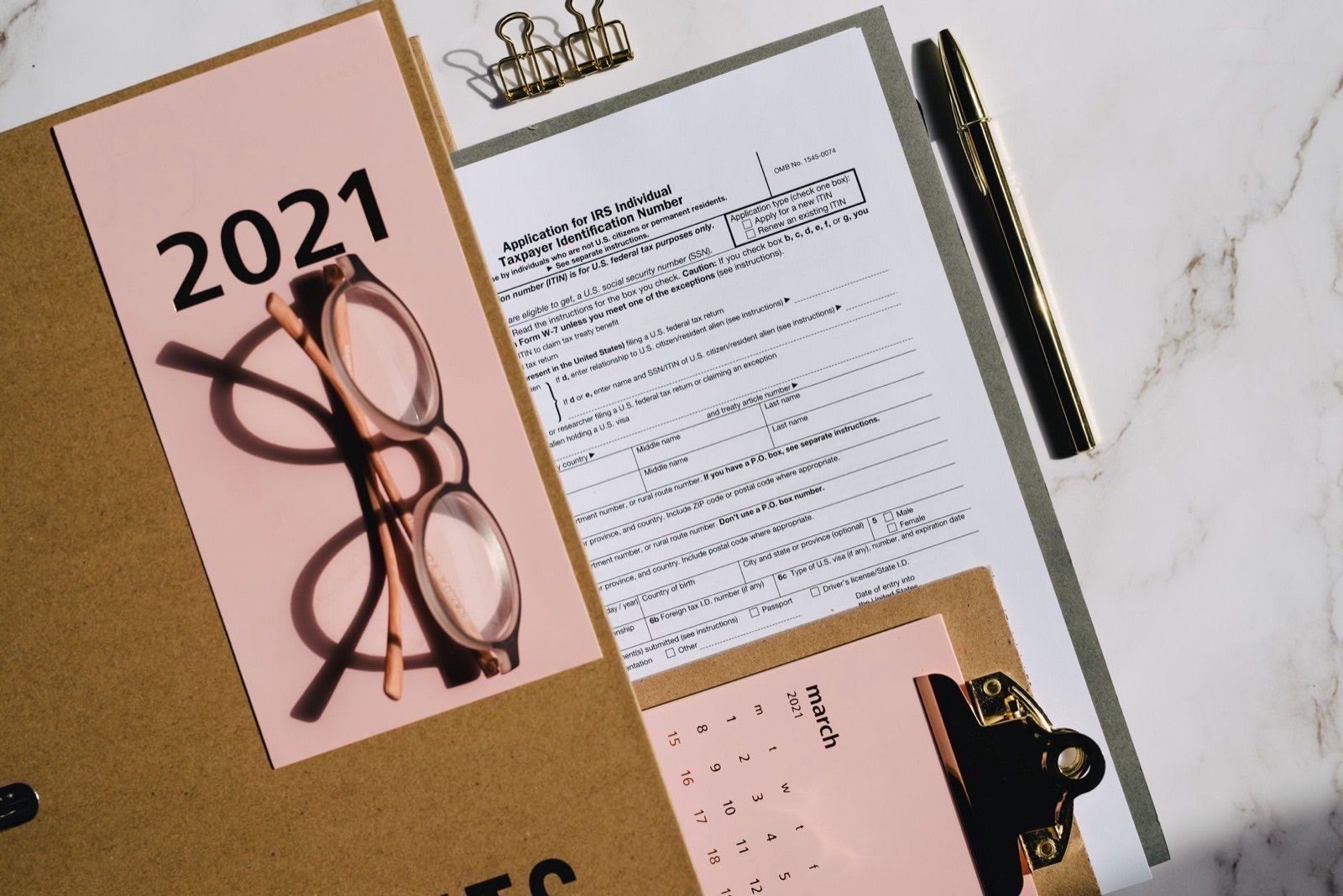 A supplier invoice and a laptop on a desk during an Austrian VAT check.